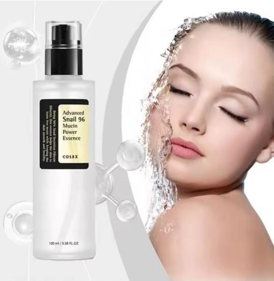 Best cosrx snail 96 mucin power essence bottle next to woman with water on her face for skin treatment