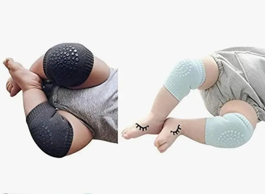 Baby wearing black and blue baby knee support for hardwood floors on crawling legs for protection