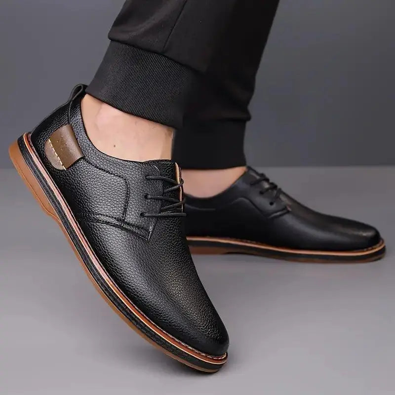 Comfortable men's lace up dress shoes in black leather with brown sole and casual design