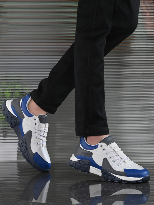 Men's casual comfortable white running shoes with blue and gray accents worn with black pants