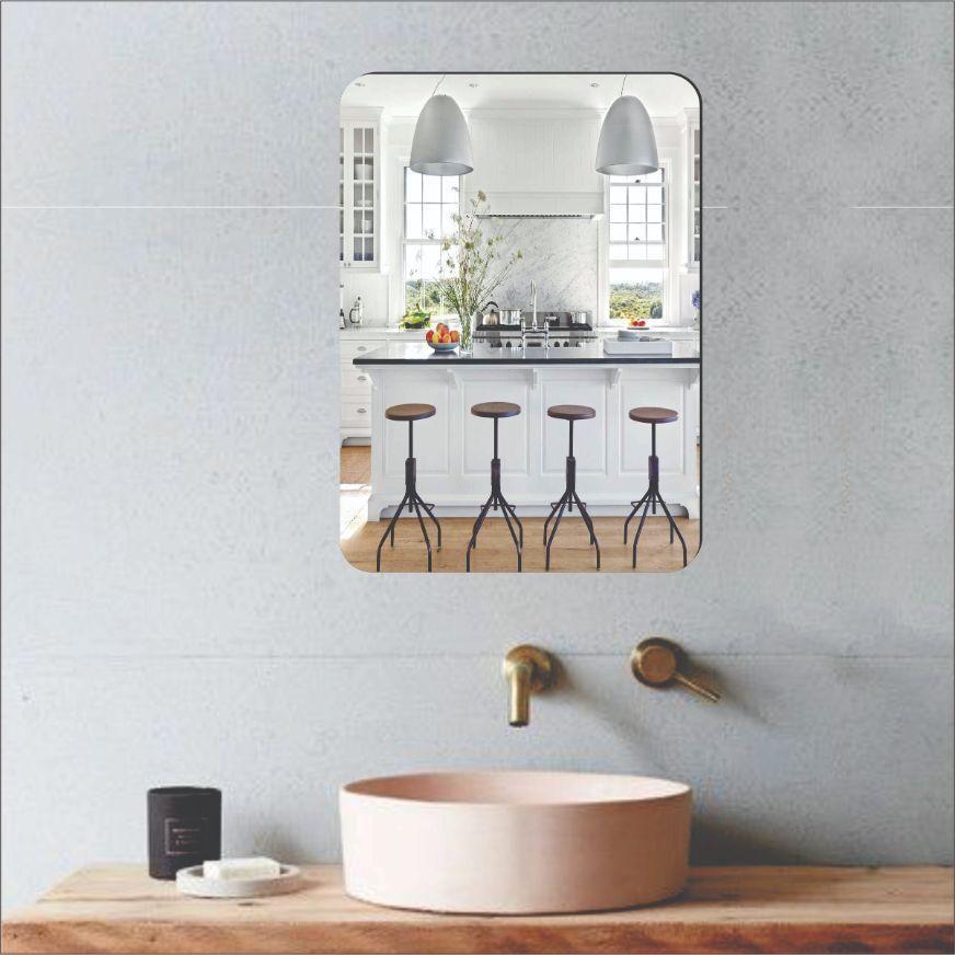 Contemporary mirror pack of 2 with rounded corners mounted above a modern bathroom sink and brass fixtures