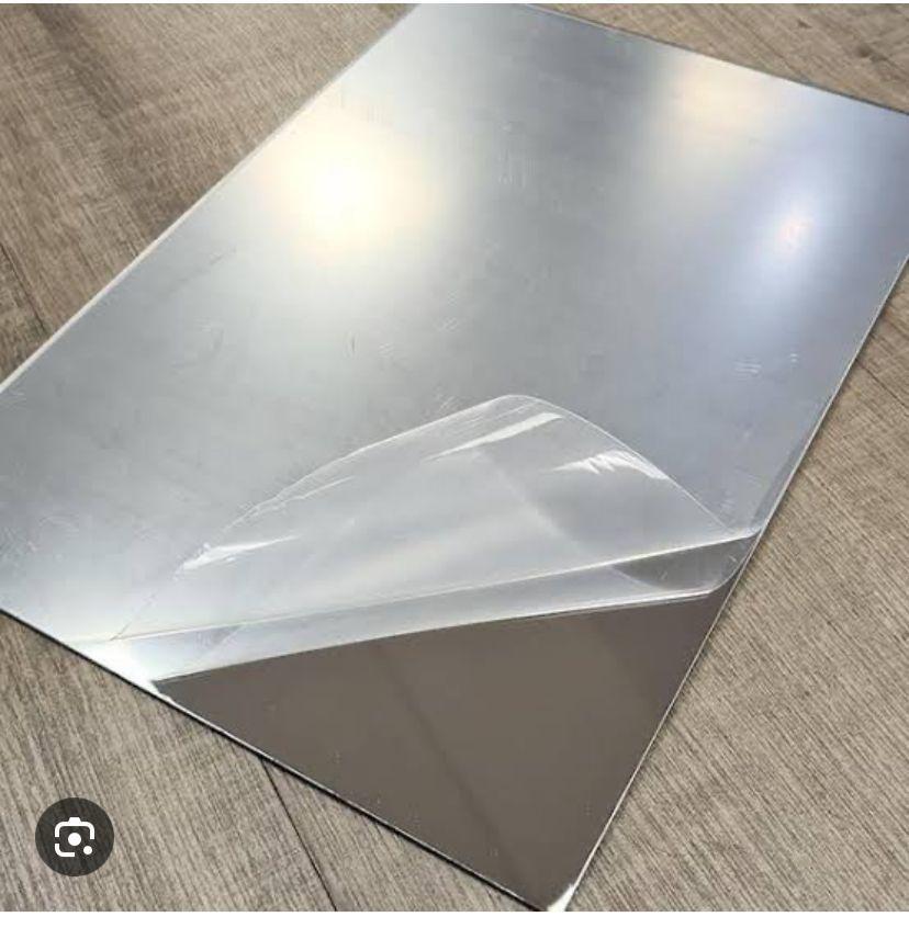 Contemporary mirror pack of 2 showing protective film being peeled off rectangular makeup mirror
