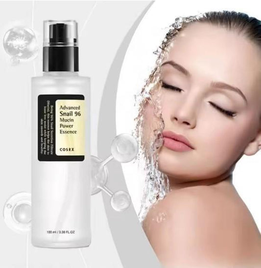 Best cosrx snail 96 mucin power essence bottle next to woman with water on her face for skin treatment