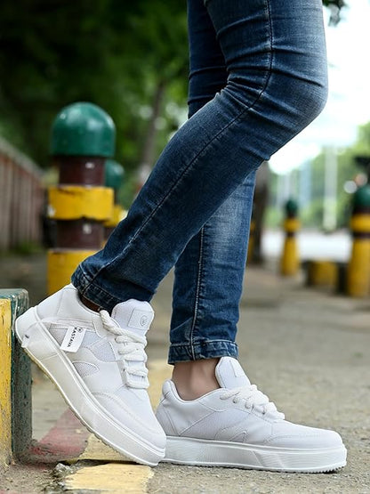 White men's sports shoes worn with jeans outdoors representing best men's everyday sneakers
