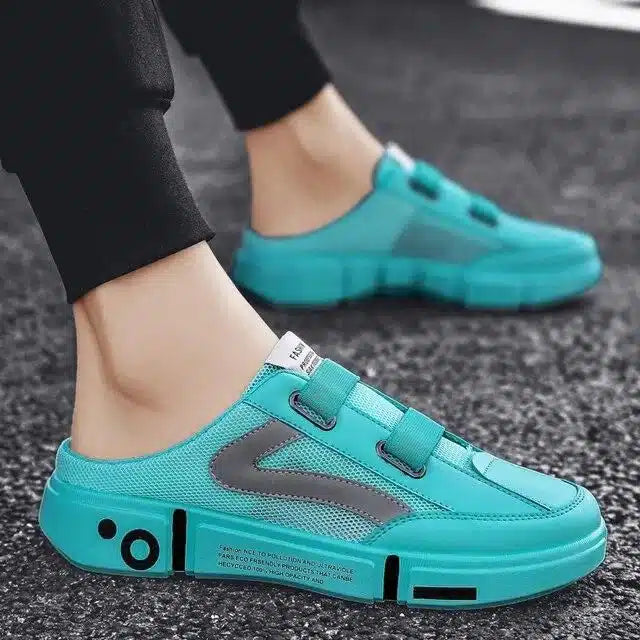 Lightweight green shoes for men in bright turquoise blue with black detailing on casual sneakers