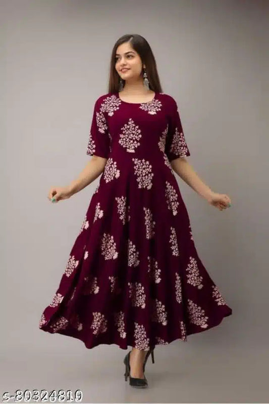 Long maroon kurti for ladies with white floral prints and half sleeves worn with black heels