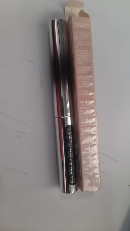 19378 eye serum packaging next to mascara for curled lashes in reflective silver tube