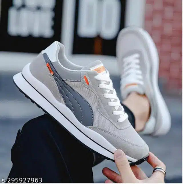 Gray men's lightweight training shoes with white laces and black sole for sports and casual wear