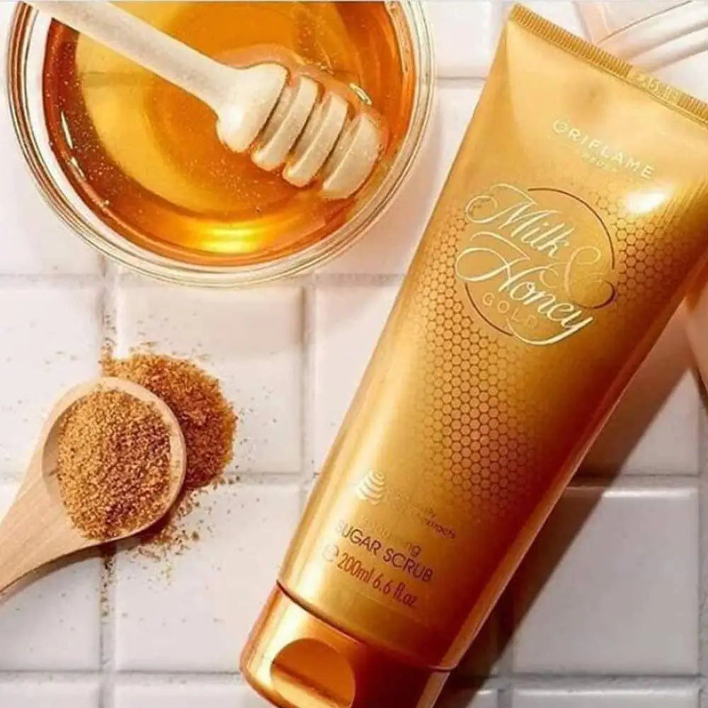 Oriflame Milk and Honey Gold sugar scrub tube alongside honey and brown sugar for the best body scrub for glowing skin
