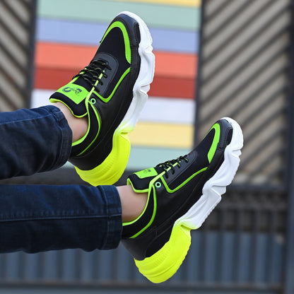 Lightweight green sports trainers for men with black and neon accents and thick white soles