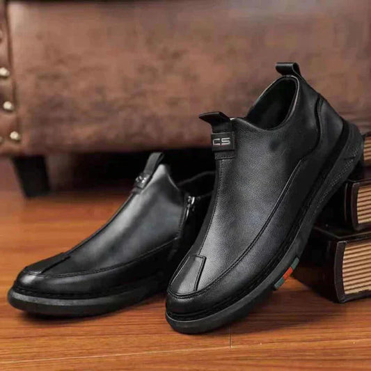 Black men's casual shoes with smooth leather finish and side zipper for easy wear