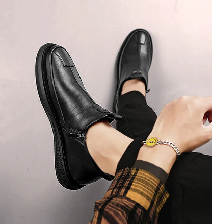 Men's casual black leather shoes with sleek design and comfortable fit worn with black pants